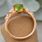 Peridot and jade engagement rings with butterfly designs