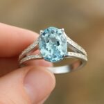 Split shank engagement ring with yellow topaz and green amethyst