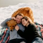 winter engagement photos with snow and engagement necklace
